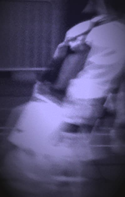 Youssef as a boy in taekwondo uniform, entering the mat at a tournament in 2010.